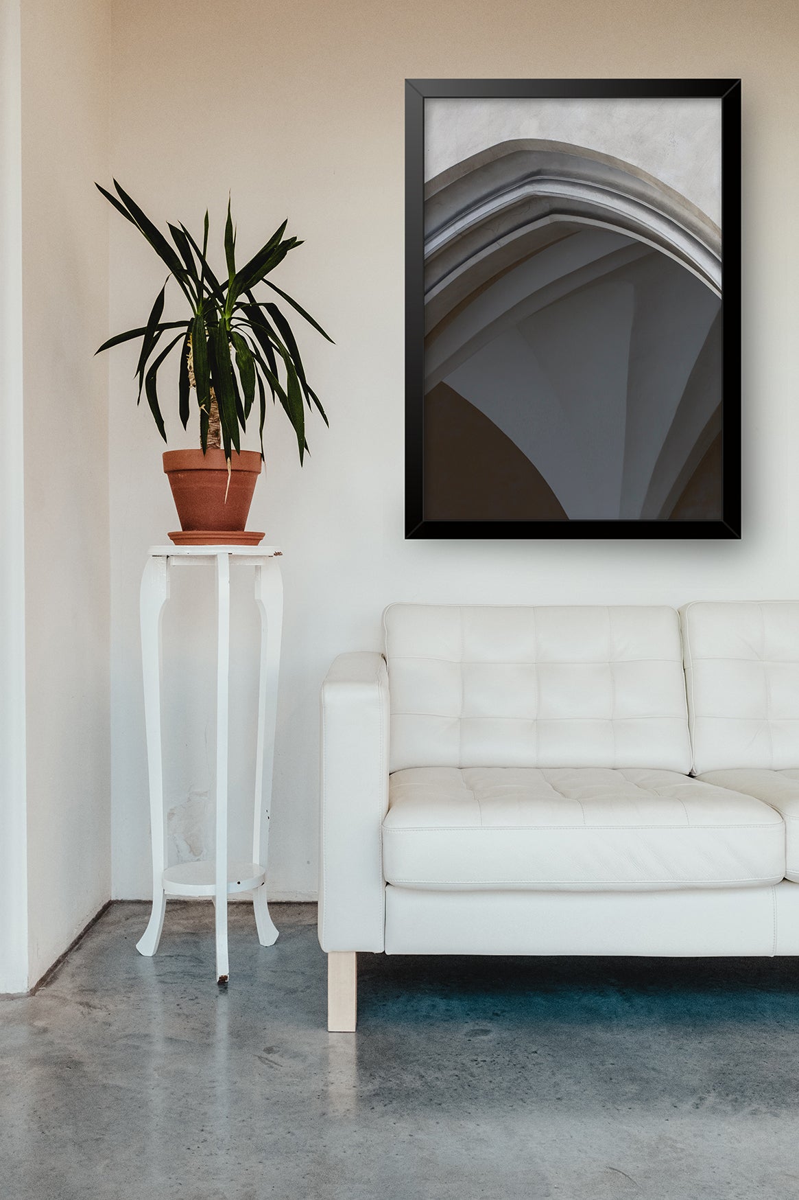 Archway photograph in situ above a white sofa.